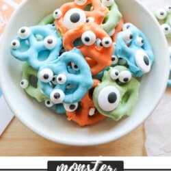 Colorful chocolate dipped pretzels with candy eyes in a white bowl.