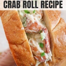 Toasted garlic bread stuffed with crab filling held in a hand.