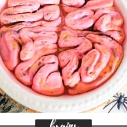 Cinnamon rolls in the shape of a brain with pink icing.