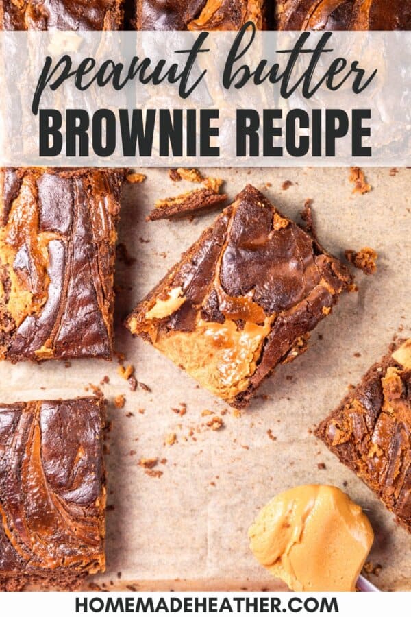 Chocolatey brownies with peanut butter swirls, cut into squares on parchment paper.
