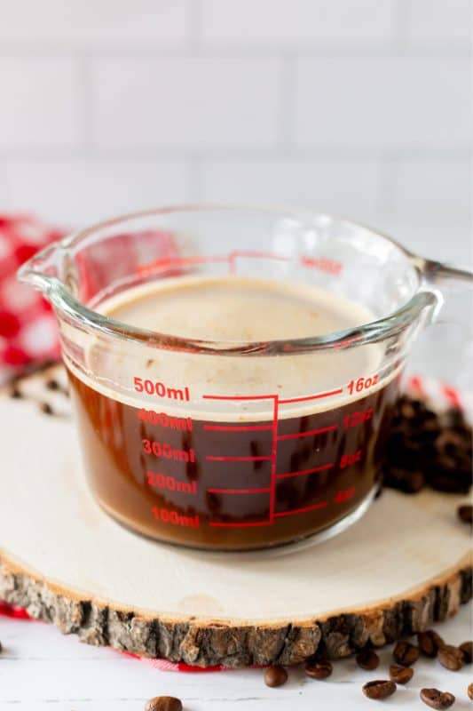 Coffee mixed in a measuring cup.