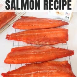 Four cold smoked salmon fillets on a wire rack on a white counter with a box of Bradley Smoker wood pucks in the background.