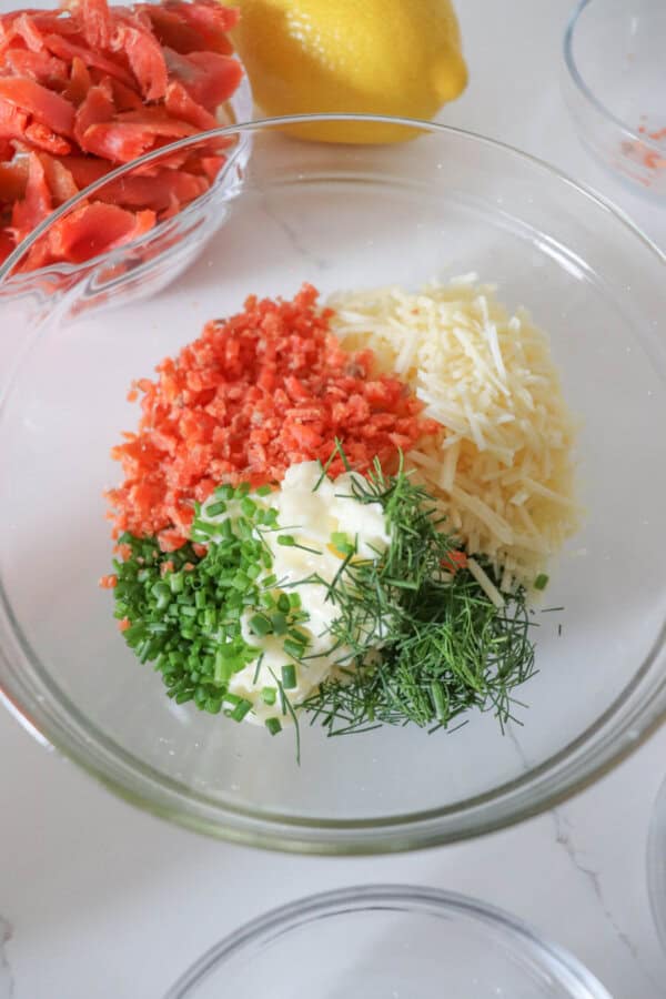 Ingredients for smoked salmon spaghetti sauce in a medium glass bowl.