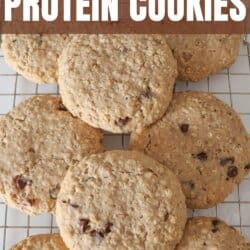 Large oatmeal chocolate chip cookies stacked on one another.