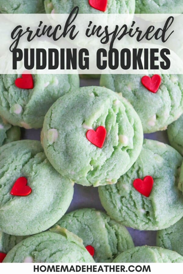 Green pudding cookies with a red candy heart stacked on top of each other.