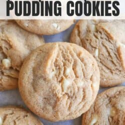 Caramel colored pumpkin spice cookies with white chocolate chips layered on top of each other.