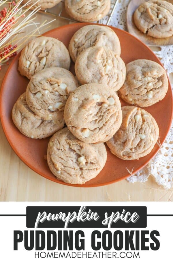 Caramel colored pumpkin spice cookies with white chocolate chips stacked on an orange plate.