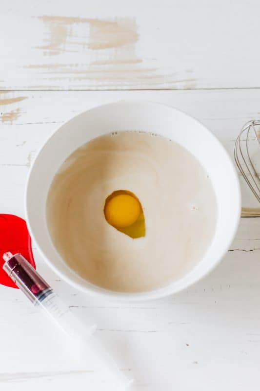 Ingredients for Halloween pancakes in a white bowl.