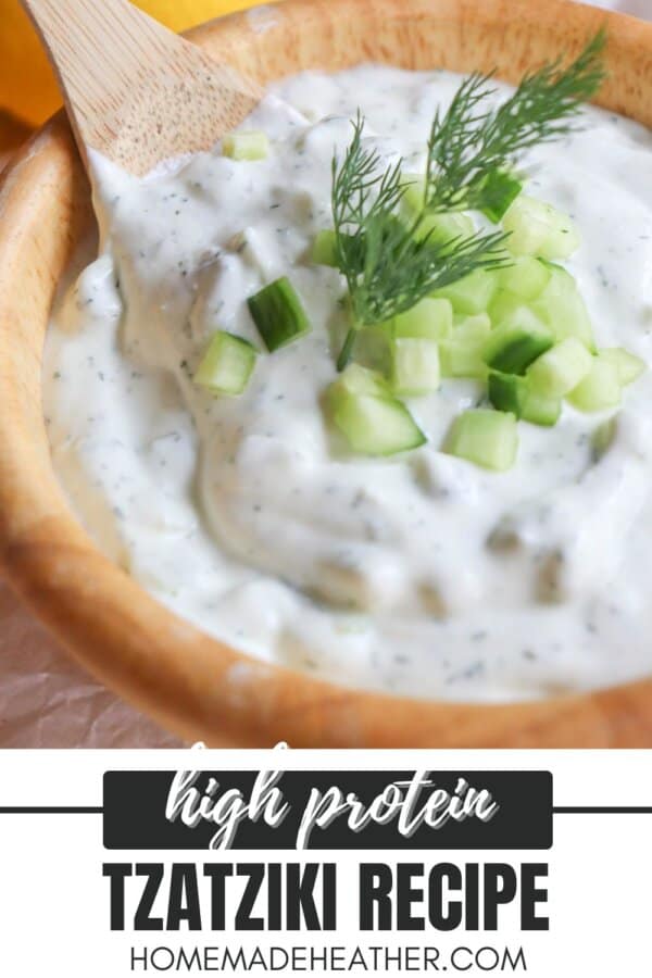 Creamy white tzatziki sauce with diced cucumber and dill garnish.