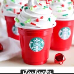 DIY Starbucks Latte Ornament with mini red solo cups adorned with white frosting, colorful sprinkles and a red striped straw.