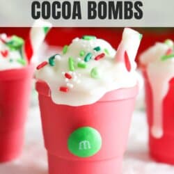 Pink and white chocolate filled with cocoa powder and in the shape of a starbucks cup.