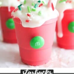 Pink and white chocolate filled with cocoa powder and in the shape of a starbucks cup.