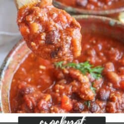 A spoonful of hearty chili with beans and meat held above a bowl. Text reads Crockpot Chili Recipe and homemadeheather.com at the bottom. Garnished with fresh herbs.