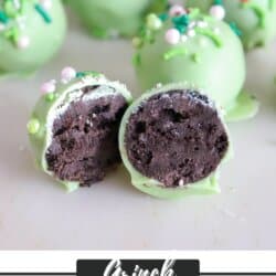 Green Grinch Oreo Balls covered in festive sprinkles with a red candy heart.