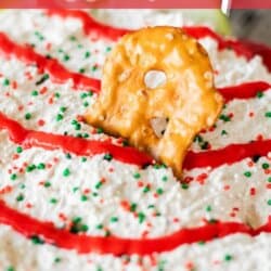 A creamy dessert dip topped with red icing drizzle and colorful sprinkles, garnished with a pretzel. The text Little Debbie Dessert Dip is displayed above, with homemadeheather.com at the bottom.