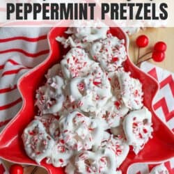 A red, star-shaped dish filled with white chocolate peppermint pretzels topped with crushed candy canes. The background features a red and white striped cloth and decorative red berries. Website URL homemadeheather.com is visible at the bottom.