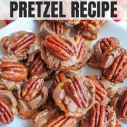 A plate of Rolo turtle pretzels topped with pecans. The treats feature caramel sandwiched between pretzels and chocolate candies. Text overlay reads Rolo Turtle Pretzel Recipe with the website homemadeheather.com at the bottom.