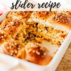 A baking dish filled with breakfast sliders, featuring scrambled eggs, cheese, and sausage, topped with sesame seeds. The text reads BREAKFAST slider recipe and homemadeheather.com is noted at the bottom.