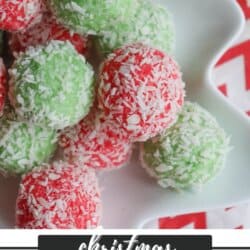 A plate of festive red and green Christmas jello balls, reminiscent of a thin mint cookie recipe, are coated with shredded coconut.