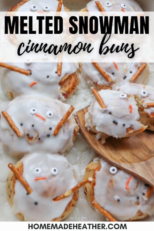 Cinnamon buns topped with white icing to resemble melted snowmen, featuring candy eyes, orange candy noses, and pretzel stick arms.