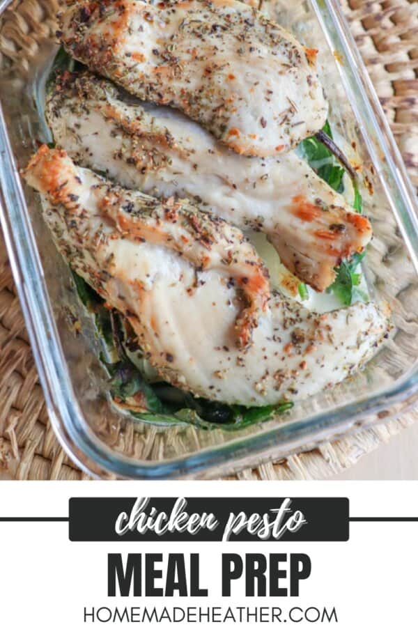 Grilled chicken pieces seasoned with herbs in a glass dish, resting on spinach leaves. The image features a chicken pesto meal prep label and a website mention: homemadeheather.com.