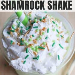 A creamy shake topped with whipped cream, green and gold sprinkles, and a green-striped straw. Text reads Ninja Creami High Protein Shamrock Shake at the top and homemadeheather.com, showcasing an irresistible shamrock shake Ninja recipe.