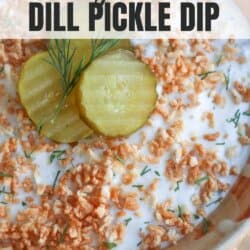 A close-up of cottage cheese dill pickle dip topped with crispy bits, dill sprigs, and pickle slices. Text at the top reads cottage cheese dill pickle dip. The bottom shows homemadeheather.com.
