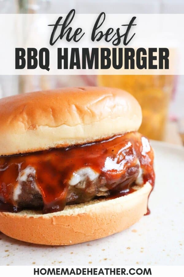 A juicy BBQ hamburger with melted cheese and barbecue sauce on a bun, displayed on a plate. The image includes text: the best BBQ hamburger and homemadeheather.com at the bottom.