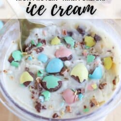 A bowl of Bunny Tracks ice cream topped with colorful chocolate eggs and chocolate pieces. Text on the image reads: Bunny Tracks High Protein Ninja Creami Ice Cream. At the bottom, it says homemadeheather.com.