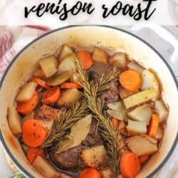 A pot of venison roast with carrots, potatoes, rosemary, bay leaves, and broth. A glass of red wine and a striped cloth are in the background. Text at the top reads The Best Venison Roast and at the bottom homemadeheather.com.