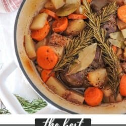 A pot of venison roast with carrots, potatoes, bay leaves, and rosemary sprigs. Text overlay: the best venison roast and homemadeheather.com at the bottom. A red and white striped cloth is partially visible on the side.