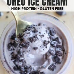 A jar of Oreo ice cream topped with crushed cookies. A spoon is scooping out a portion. Text at the top reads ninja creami OREO ICE CREAM and HIGH PROTEIN • GLUTEN FREE. At the bottom is a website name: HOMEMADEHEATHER.COM.