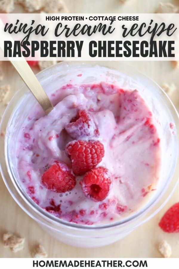 A creamy raspberry cheesecake mix in a glass bowl, crowned with fresh raspberries. A gold spoon plunges into the treat. Text on the image reads Ninja Creami Recipe Raspberry Cheesecake and homemadeheather.com, evoking dreams of blueberry cheesecake ice cream delights.