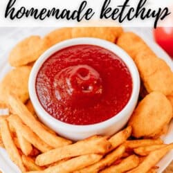 A white plate holds golden fries and chicken nuggets surrounding a small bowl of homemade ketchup. The text above reads Viral Recipe Homemade Ketchup and the bottom credits homemadeheather.com.