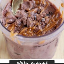 A plastic container filled with chocolate ice cream, drizzled with caramel sauce, and topped with chocolate chunks. A spoon is placed inside. A label reads ninja creami chocolate caramel homemadeheather.com.
