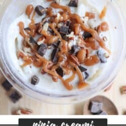 A close-up of turtle ice cream topped with caramel drizzle, chocolate chunks, and pecan pieces. The text at the bottom reads ninja creami TURTLE ICE CREAM homemadeheather.com.