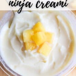 A bowl of creamy Dole Whip topped with small pineapple chunks. The text COPYCAT DOLE WHIP ninja creami is at the top, and homemadeheather.com is at the bottom.