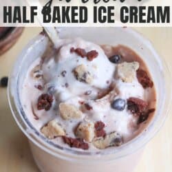 A close-up of a creamy dessert in a cup, with chunks of what appear to be cookies, chocolate chips, and possibly bits of brownie. Text on the image reads, Copycat High Protein Ninja Creami Half Baked Ice Cream.