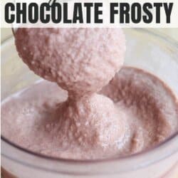 A spoon scooping a thick, creamy, chocolate frosty from a glass container labeled MAX FILL. The text on the image reads Copycat High Protein Ninja Creami Chocolate Frosty and homemadeheather.com at the bottom.
