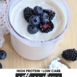 A cup of creamy cottage cheese topped with fresh blackberries and blueberries. The text reads High Protein • Low Carb and Cottage Cheese Ninja Creami Recipe with homemadeheather.com below.