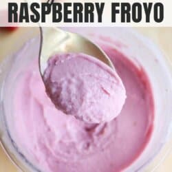 A spoonful of pink raspberry frozen yogurt is held above a container filled with more yogurt. The text above reads High Protein Ninja Creami Raspberry Froyo, and below reads homemadeheather.com.