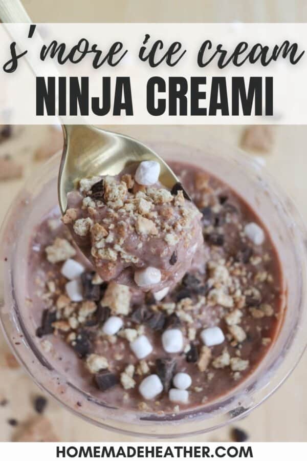 A spoon scoops smore ice cream from a bowl, filled with bits of chocolate, marshmallows, and crumbly graham crackers. The top text reads smore ice cream NINJA CREAMI, with a website link homemadeheather.com at the bottom.
