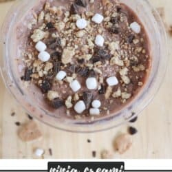 A bowl of chocolate ice cream topped with marshmallows, chocolate chunks, and crumbled graham crackers. The text reads, ninja creami Smore Ice Cream with the website homemadeheather.com below.