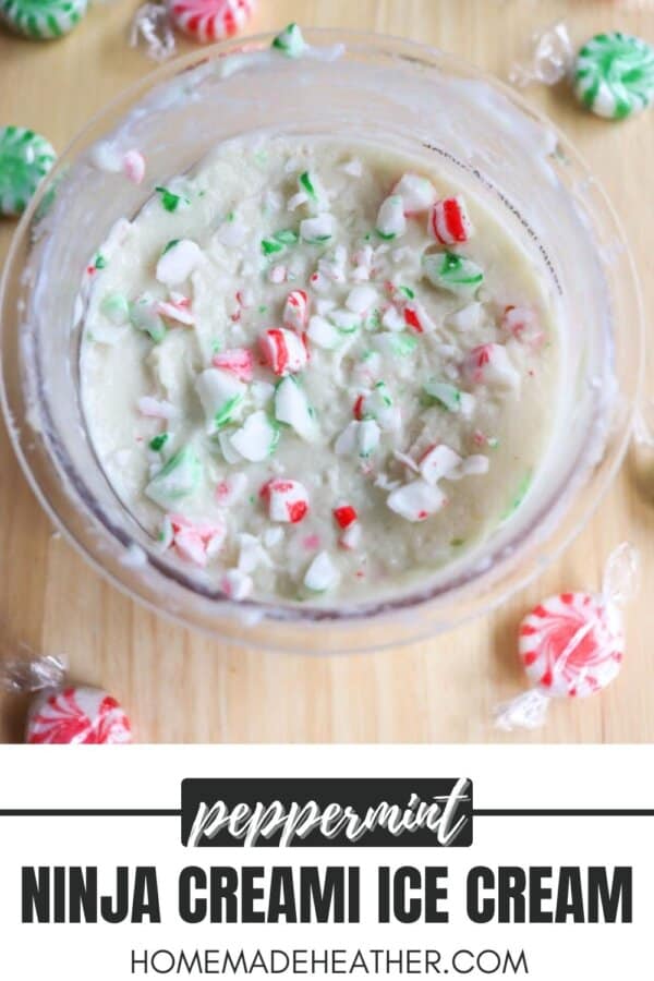 A bowl of homemade peppermint ice cream with crushed peppermint candies on top. Surrounding the bowl are unwrapped peppermint candies on a wooden surface. Text at the bottom reads, Peppermint Ninja Creami Ice Cream homemadetheather.com.
