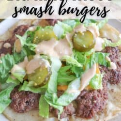 A plate of Big Mac tacos with ground beef, shredded lettuce, pickles, and sauce on a tortilla, topped with drizzled sauce. Text reads: BIG MAC TACOS smash burgers and homemadeheather.com.