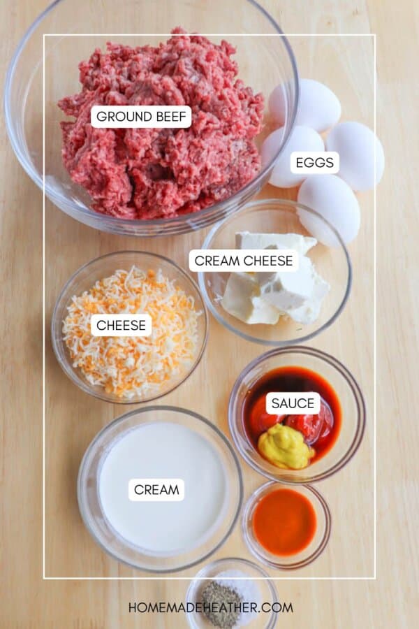 Overhead view of clear bowls containing diced ground beef, four eggs, cream cheese, shredded cheese, sauce, cream, and seasoning. The items are labeled: GROUND BEEF, EGGS, CREAM CHEESE, CHEESE, SAUCE, and CREAM.
