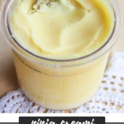 A close-up of a creamy peach sorbet in a clear cup with a spoon, placed on a lace doily. Text reads Ninja Creami Peach Sorbet Recipe from homemadeheather.com.