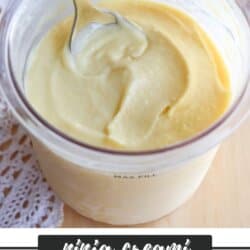 A clear container of creamy mango sorbet is shown with a spoon dipped into it. The container rests on a lace tablecloth. Text at the bottom reads ninja creami MANGO SORBET RECIPE homemadeheather.com.