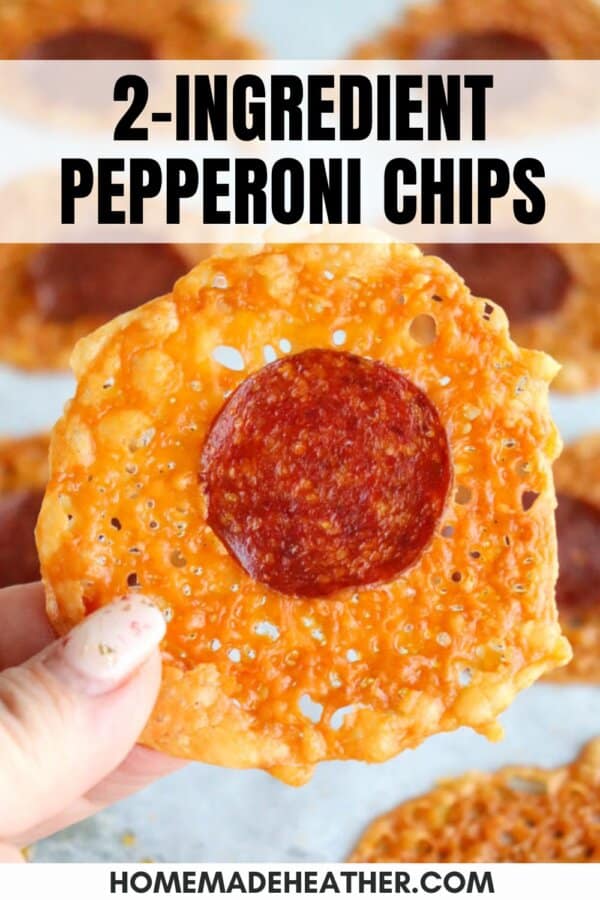 A hand holds a crispy chip with a slice of pepperoni in the center. More chips are visible in the background. Text on the image reads: 2-Ingredient Pepperoni Chips.