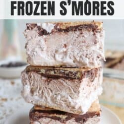 A stack of three frozen smores with layers of marshmallow, chocolate, and graham crackers. The top smore is slightly tilted. The text on the image reads Viral Recipe Frozen Smores and homemadeheather.com.